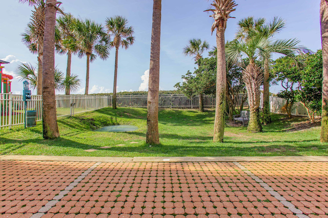 8499 Gulf Blvd Unit 303, Navarre, FL 32566 - surrounding community with a patio