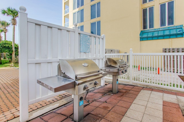 8499 Gulf Blvd Unit 303, Navarre, FL 32566 - view of patio / terrace featuring area for grilling