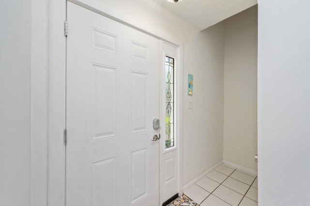 208 3rd St Unit J, Fort Walton Beach, FL 32548 - foyer entrance featuring baseboards and light tile patterned flooring