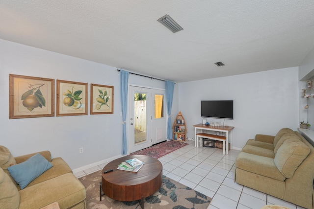 208 3rd St Unit J, Fort Walton Beach, FL 32548 - living area with light tile patterned flooring and a textured ceiling