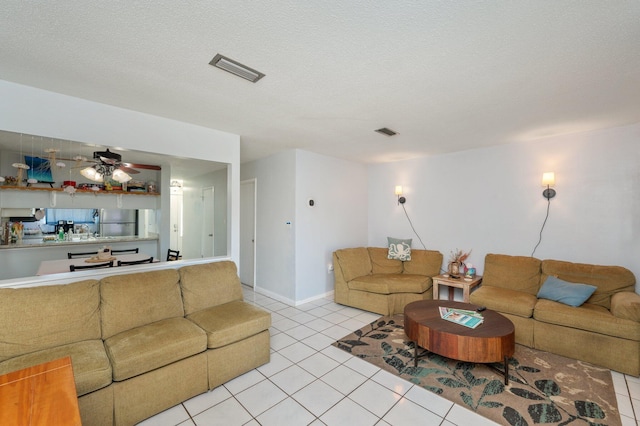 208 3rd St Unit J, Fort Walton Beach, FL 32548 - living room featuring light tile patterned flooring, ceiling fan, and baseboards