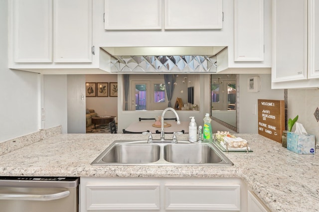 208 3rd St Unit J, Fort Walton Beach, FL 32548 - kitchen featuring a sink, dishwasher, and white cabinets
