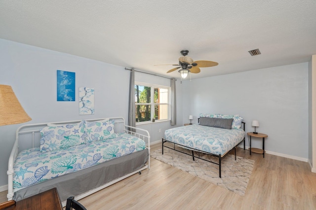 208 3rd St Unit J, Fort Walton Beach, FL 32548 - bedroom featuring wood finished floors, baseboards, and ceiling fan