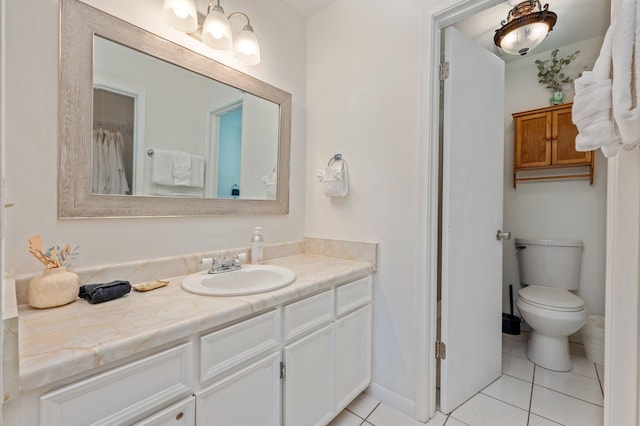 208 3rd St Unit J, Fort Walton Beach, FL 32548 - full bathroom featuring vanity, tile patterned floors, toilet, and baseboards