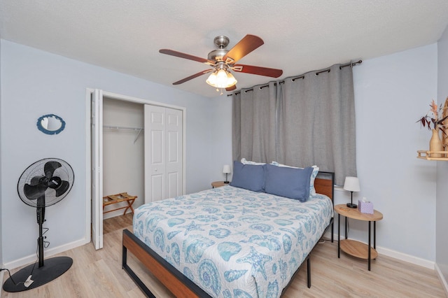 208 3rd St Unit J, Fort Walton Beach, FL 32548 - bedroom featuring light wood finished floors, a closet, baseboards, and ceiling fan