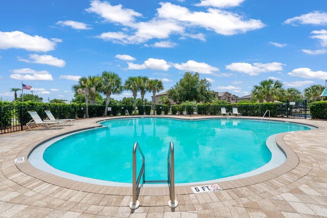 2131 Wilsons Plover Cir, Navarre, FL 32566 - community pool with a patio