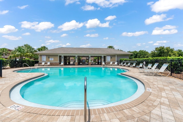 2131 Wilsons Plover Cir, Navarre, FL 32566 - community pool featuring a patio area
