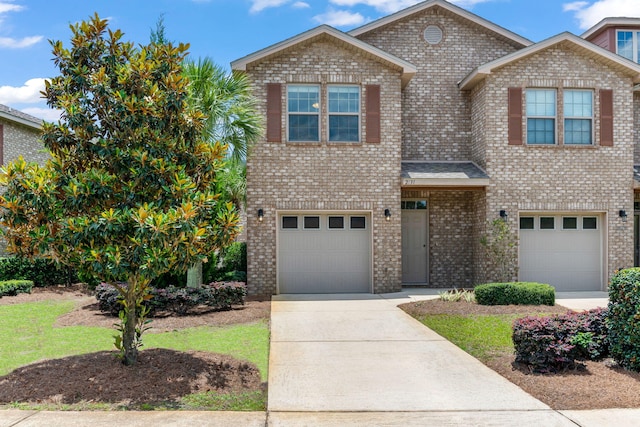 2131 Wilsons Plover Cir, Navarre, FL 32566 - view of front of house featuring a garage, driveway, and brick siding
