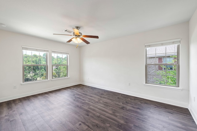 2131 Wilsons Plover Cir, Navarre, FL 32566 - unfurnished room with a ceiling fan, baseboards, and dark wood-type flooring