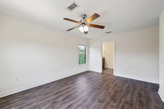2131 Wilsons Plover Cir, Navarre, FL 32566 - empty room with ceiling fan, dark wood-style floors, and baseboards