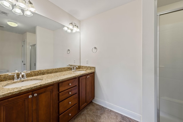 2131 Wilsons Plover Cir, Navarre, FL 32566 - full bathroom with double vanity, a shower with shower door, tile patterned floors, baseboards, and toilet