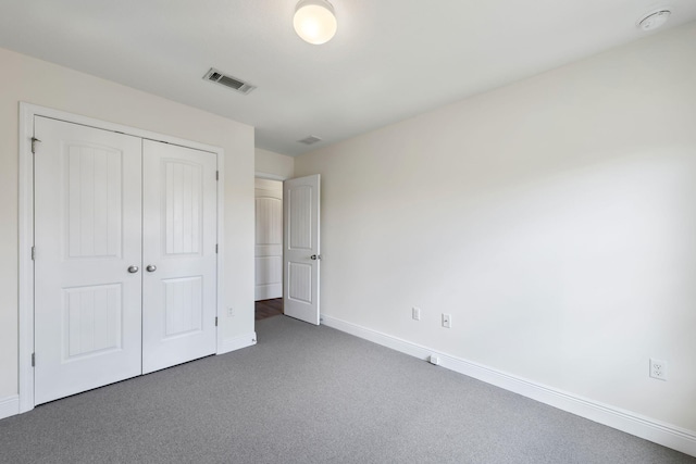 2131 Wilsons Plover Cir, Navarre, FL 32566 - unfurnished bedroom featuring a closet, baseboards, and carpet