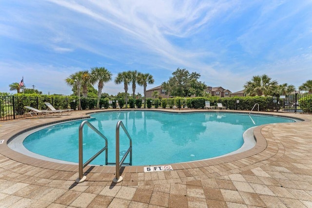 2131 Wilsons Plover Cir, Navarre, FL 32566 - community pool featuring a patio area