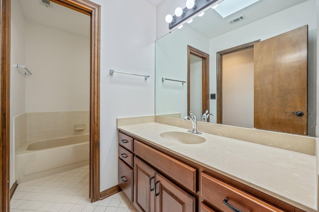 805 Turnberry Way, Niceville, FL 32578 - full bath with vanity, a garden tub, tile patterned flooring, and baseboards