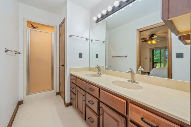 805 Turnberry Way, Niceville, FL 32578 - full bath with ensuite bath, ceiling fan, double vanity, a shower stall, and baseboards