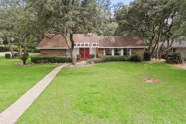 1127 Muirfield Way, Niceville, FL 32578 - mid-century home featuring a front lawn, brick siding, and a shingled roof