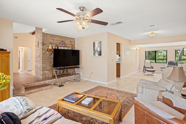 1127 Muirfield Way, Niceville, FL 32578 - living area with light tile patterned flooring, a ceiling fan, and a textured ceiling