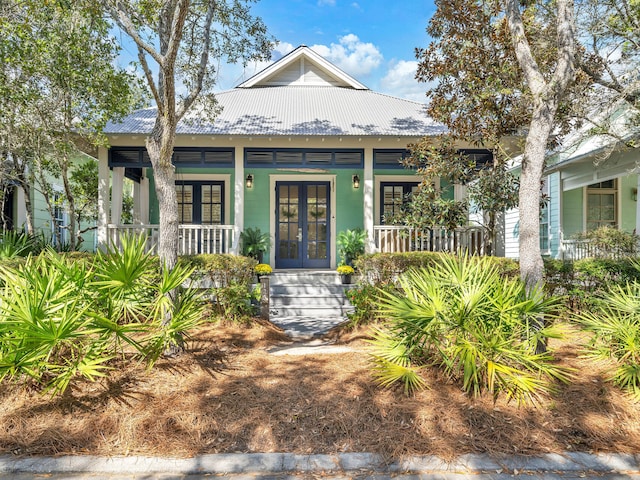 125 Silver Laurel Way, Santa Rosa Beach, FL 32459 - view of front of home featuring french doors, covered porch, and a metal roof