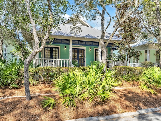 125 Silver Laurel Way, Santa Rosa Beach, FL 32459 - bungalow featuring a porch, french doors, and a metal roof