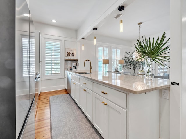 125 Silver Laurel Way, Santa Rosa Beach, FL 32459 - kitchen with plenty of natural light, white cabinetry, light wood-style floors, and recessed lighting