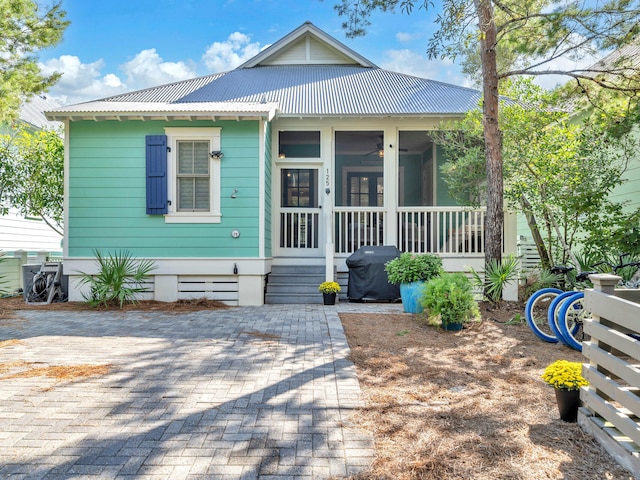 125 Silver Laurel Way, Santa Rosa Beach, FL 32459 - view of front facade featuring a metal roof and a sunroom