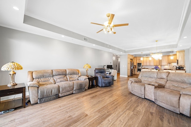5 Calhoun Ave Unit 505, Destin, FL 32541 - living area featuring a tray ceiling, a ceiling fan, light wood finished floors, recessed lighting, and ornamental molding