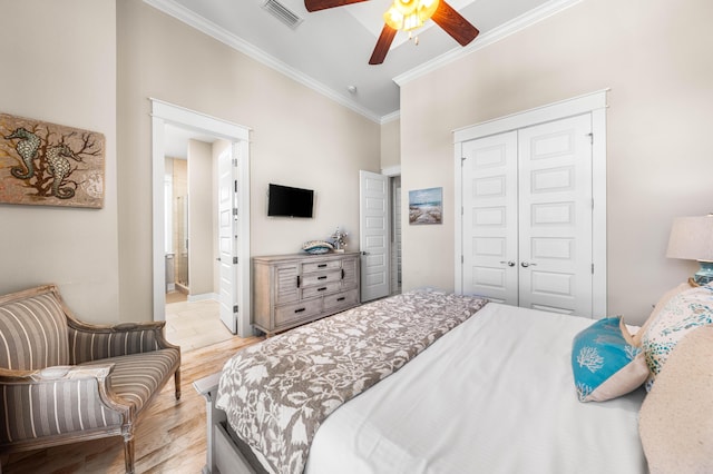 62 Dune Comet Ln Unit B, Inlet Beach, FL 32461 - bedroom featuring ornamental molding, a closet, light wood-style flooring, a ceiling fan, and ensuite bath