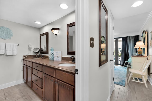 291 Scenic Gulf Dr Unit 201, Miramar Beach, FL 32550 - full bathroom with double vanity, baseboards, and recessed lighting
