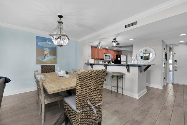 291 Scenic Gulf Dr Unit 201, Miramar Beach, FL 32550 - dining room featuring baseboards, a chandelier, light wood finished floors, ornamental molding, and recessed lighting