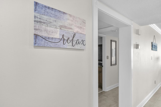 291 Scenic Gulf Dr Unit 201, Miramar Beach, FL 32550 - corridor featuring baseboards