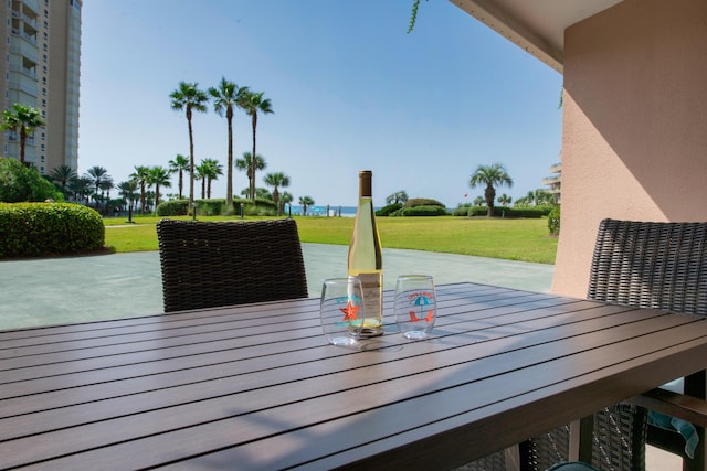 291 Scenic Gulf Dr Unit 201, Miramar Beach, FL 32550 - wooden deck featuring a patio area and a lawn
