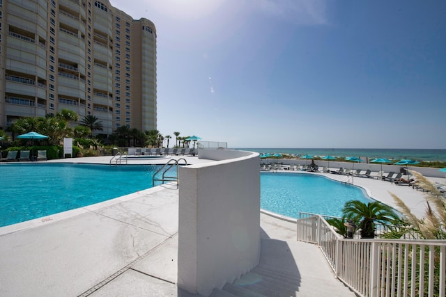 291 Scenic Gulf Dr Unit 201, Miramar Beach, FL 32550 - community pool featuring a patio area