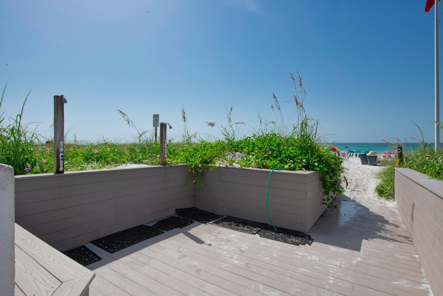 291 Scenic Gulf Dr Unit 201, Miramar Beach, FL 32550 - wooden deck with view of water and beach