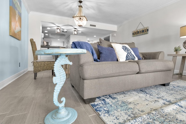 291 Scenic Gulf Dr Unit 201, Miramar Beach, FL 32550 - living room with crown molding, baseboards, and light tile patterned floors