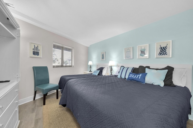 291 Scenic Gulf Dr Unit 201, Miramar Beach, FL 32550 - bedroom featuring wood finished floors and baseboards