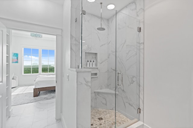206 Henderson Resort Way Unit 5401, Destin, FL 32541 - ensuite bathroom featuring a marble finish shower, marble look tiles, and baseboards