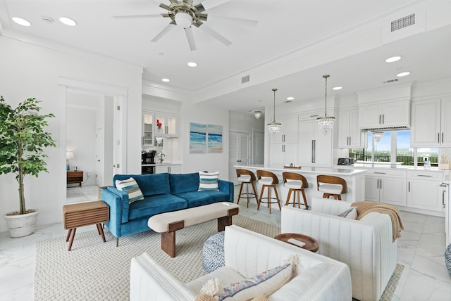 206 Henderson Resort Way Unit 5401, Destin, FL 32541 - living room with light marble finish flooring, ceiling fan, recessed lighting, and ornamental molding