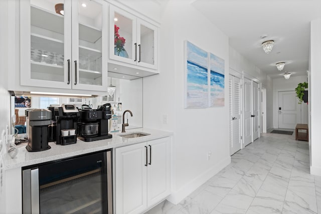 206 Henderson Resort Way Unit 5401, Destin, FL 32541 - indoor wet bar with light marble finish floors, wine cooler, and baseboards