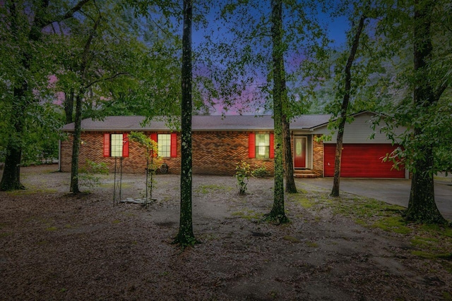 3544 State Highway 85, Laurel Hill, FL 32567 - view of front facade with driveway, a garage, and brick siding
