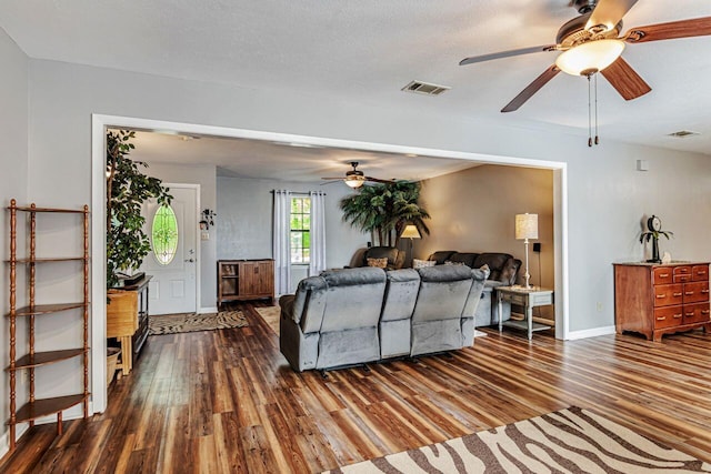 3544 State Highway 85, Laurel Hill, FL 32567 - living room featuring a ceiling fan and dark wood-style flooring