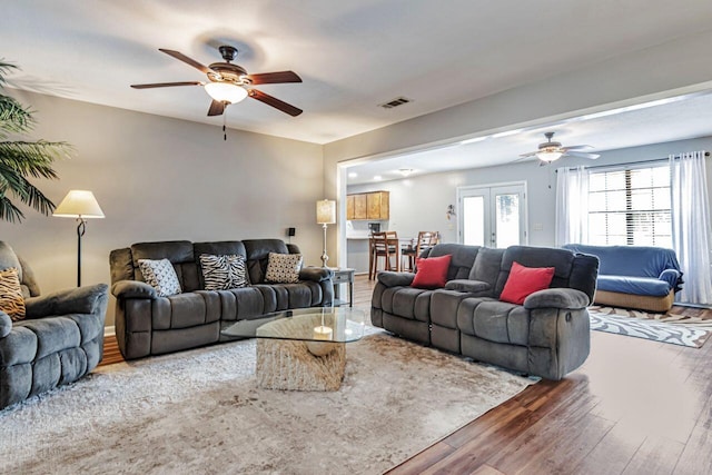 3544 State Highway 85, Laurel Hill, FL 32567 - living area featuring ceiling fan, wood finished floors, and french doors