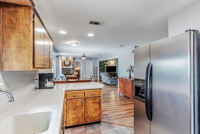 3544 State Highway 85, Laurel Hill, FL 32567 - kitchen featuring stainless steel refrigerator with ice dispenser, a peninsula, ceiling fan, recessed lighting, and open floor plan