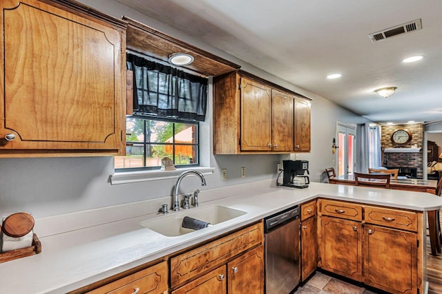 3544 State Highway 85, Laurel Hill, FL 32567 - kitchen featuring stainless steel dishwasher, a peninsula, light countertops, brown cabinets, and recessed lighting