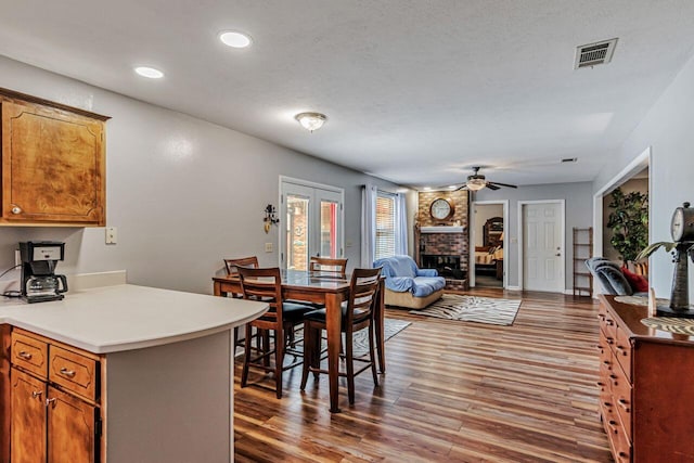 3544 State Highway 85, Laurel Hill, FL 32567 - dining space featuring wood finished floors, ceiling fan, a fireplace, and recessed lighting