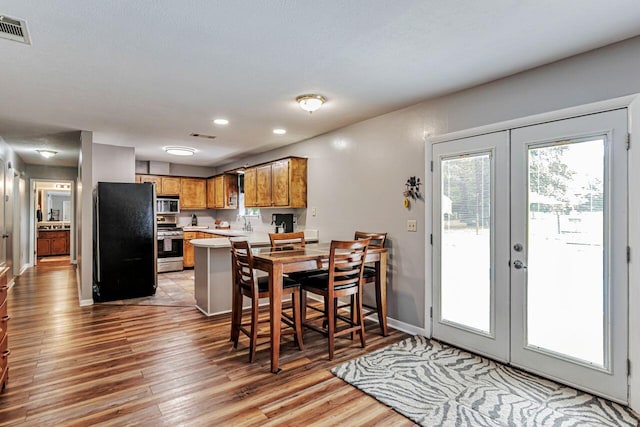 3544 State Highway 85, Laurel Hill, FL 32567 - dining area with french doors, light wood finished floors, and recessed lighting