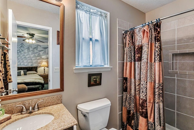 3544 State Highway 85, Laurel Hill, FL 32567 - ensuite bathroom with vanity, a ceiling fan, a shower with curtain, and a textured ceiling