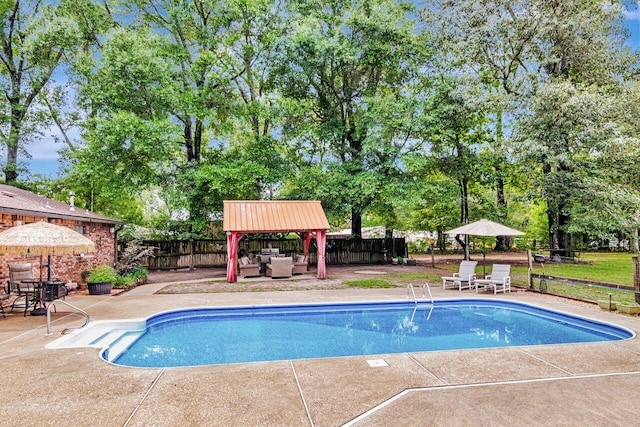 3544 State Highway 85, Laurel Hill, FL 32567 - view of swimming pool featuring a gazebo, a patio area, a fenced backyard, and an outdoor hangout area