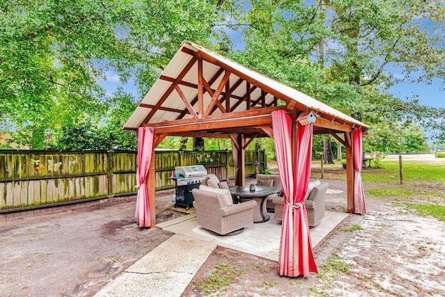 3544 State Highway 85, Laurel Hill, FL 32567 - fenced backyard featuring a gazebo, area for grilling, and a patio area