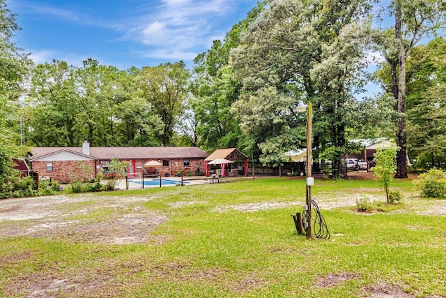 3544 State Highway 85, Laurel Hill, FL 32567 - view of yard featuring an outdoor pool, a patio, and view of scattered trees