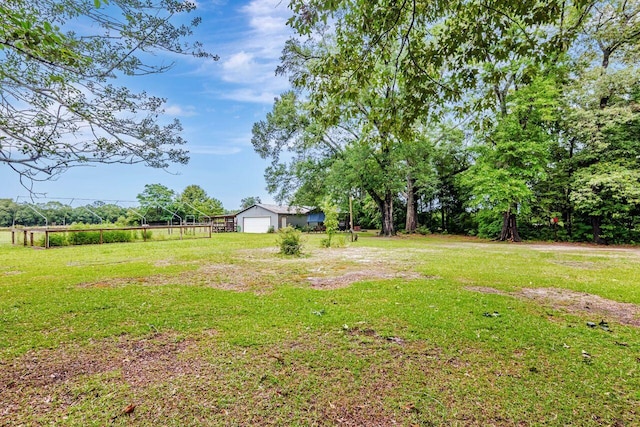 3544 State Highway 85, Laurel Hill, FL 32567 - view of green lawn with a garage and an outbuilding